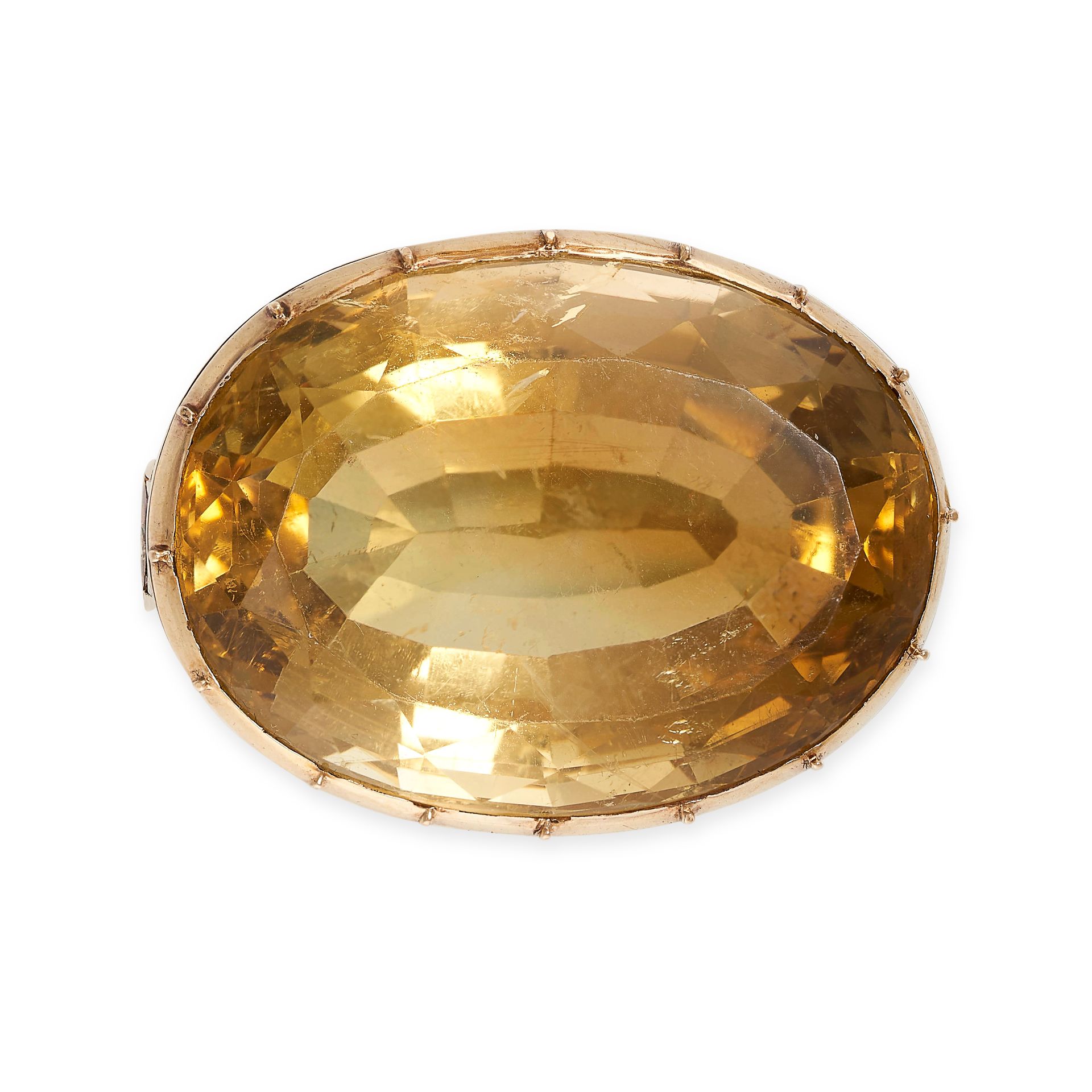 AN ANTIQUE CITRINE BROOCH in 18ct yellow gold, set with a large oval cut citrine in a pinched collet