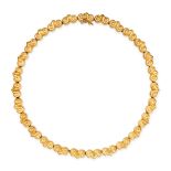 LALAOUNIS, A GOLD COLLAR NECKLACE in 18ct yellow gold, comprising a single row of scrolling