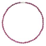 A RUBY BEAD NECKLACE comprising a single row of faceted ruby beads, stamped 925, 49.0cm, 23.8g.