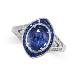 A SAPPHIRE AND DIAMOND RING in 18ct white gold, the navette face set with an oval cut sapphire of