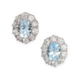 A PAIR OF AQUAMARINE AND DIAMOND CLUSTER EARRINGS in 18ct white gold, each set with an oval cut