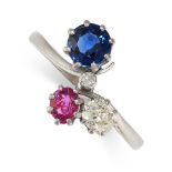 A SAPPHIRE, DIAMOND AND RUBY DRESS RING in 18ct white gold, set with a round cut sapphire, a