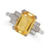 A YELLOW SAPPHIRE AND DIAMOND RING in platinum, set with an emerald cut yellow sapphire of 3.50