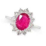 A RUBY AND DIAMOND CLUSTER RING in 18ct white gold, set with an oval cut ruby of 1.89 carats, in a