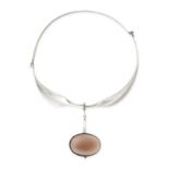 GEORG JENSEN, A GEMSET NECK RING in silver, designed by Viviana Torun, design number 242, the collar