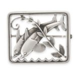 GEORG JENSEN, A DOLPHIN BROOCH, CIRCA 1956 in silver, designed by Arno Malinowski, design number