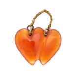 NO RESERVE - AN ANTIQUE CARNELIAN SWEETHEART PENDANT in yellow gold, carved to depict two double