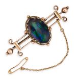 NO RESERVE - A BLACK OPAL BROOCH in 9ct yellow gold, set with a central cabochon black opal of