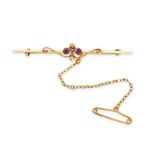 TWO ANTIQUE GEMSET BROOCHES in 15ct yellow gold, one with two round cut amethysts in scrolling