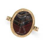 A VINTAGE HARDSTONE INTAGLIO SWIVEL SEAL RING in yellow gold, set with a rotating piece of carved