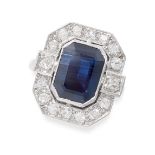 A FRENCH SAPPHIRE AND DIAMOND DRESS RING in platinum, set with an emerald cut blue sapphire of
