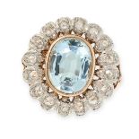 AN AQUAMARINE AND DIAMOND DRESS RING in yellow gold and silver, set with an oval cut aquamarine of