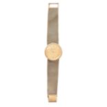 BUECHE GIROD, A VINTAGE GOLD WATCH, in 9ct yellow gold, waffle print face with baton hour markers,