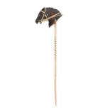 AN ANTIQUE TORTOISESHELL HORSE STICK / TIE PIN BROOCH in yellow gold, designed as a bridled horse