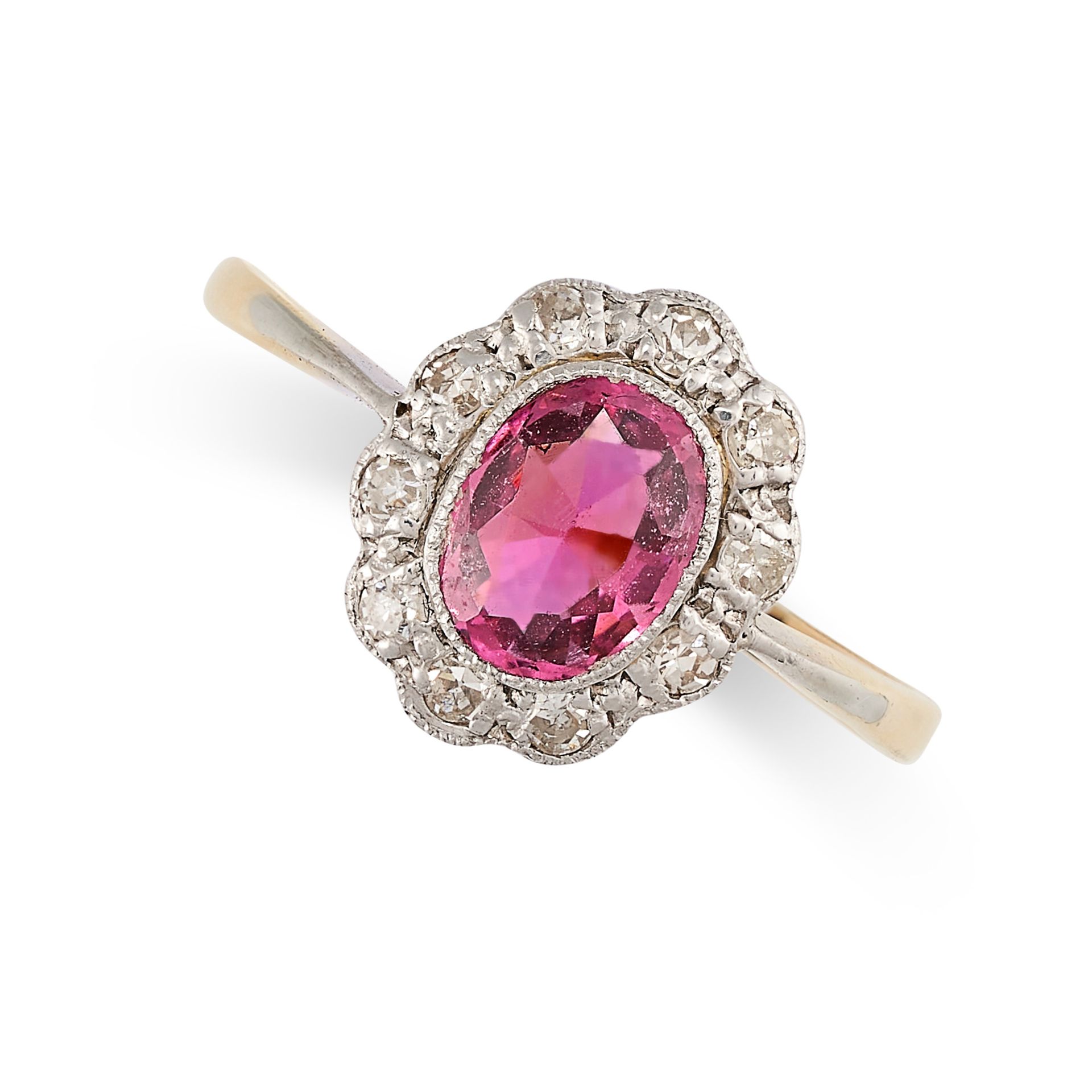 A SPINEL AND DIAMOND DRESS RING in yellow gold, set with an oval cut pink spinel of 1.01 carats