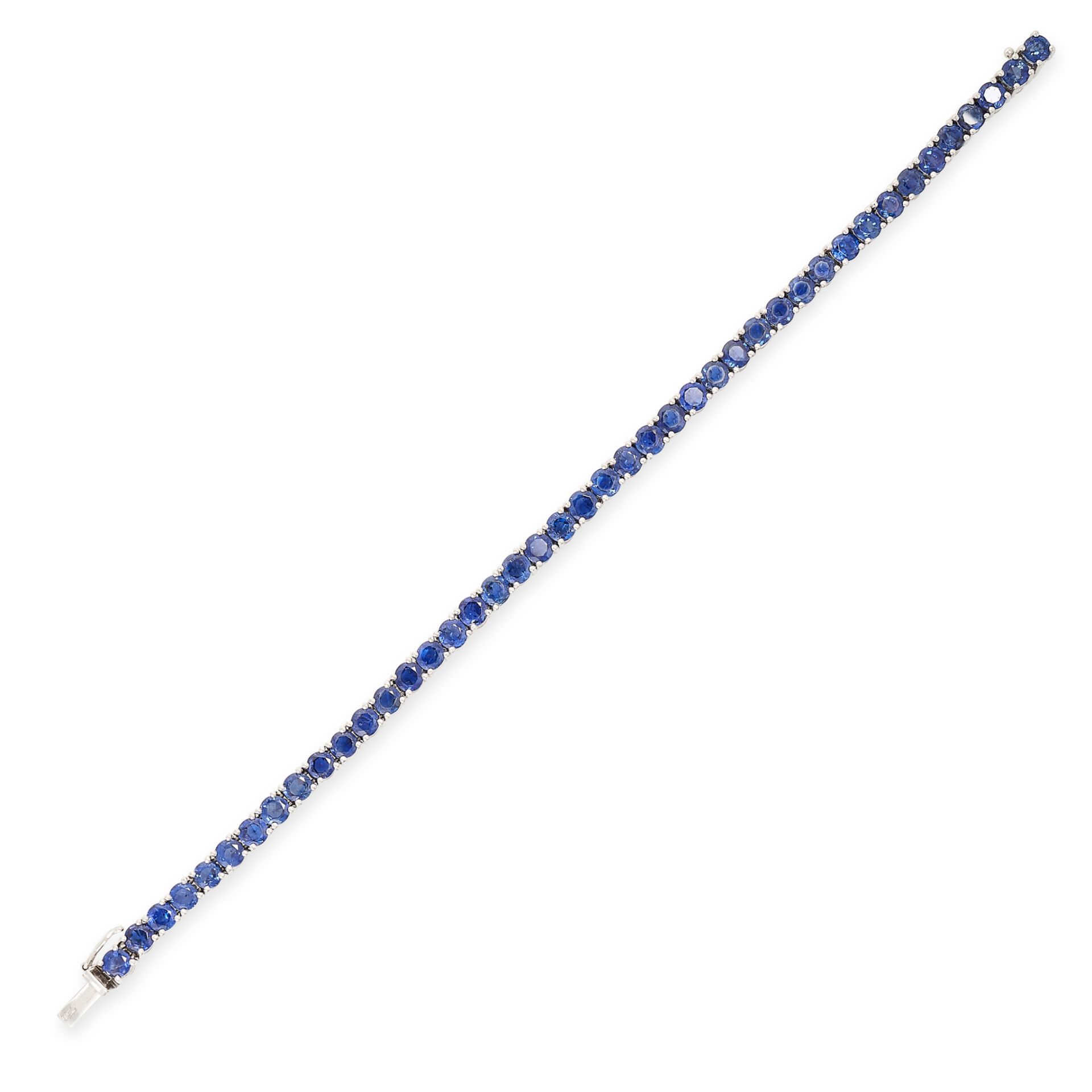 A BLUE SAPPHIRE LINE BRACELET in 18ct white gold, set with a single row of round cut blue sapphires,