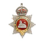 AN ANTIQUE DIAMOND, ENAMEL, RUBY AND EMERALD MANCHESTER REGIMENT MILITARY BROOCH / PENDANT in