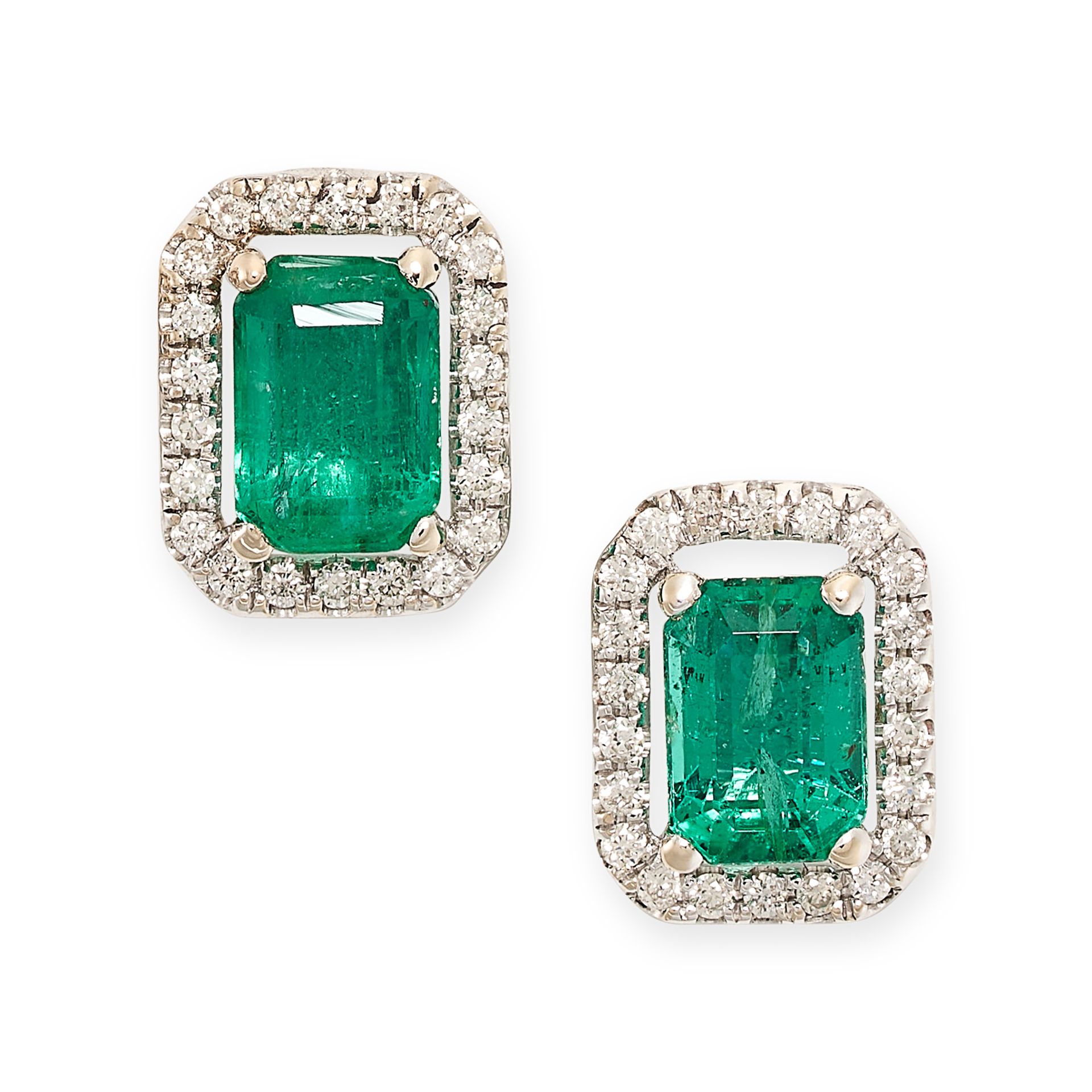 A PAIR OF EMERALD AND DIAMOND STUD EARRINGS in 18ct white gold, each set with an emerald cut emerald