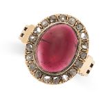 AN ANTIQUE GARNET AND DIAMOND DRESS RING in high carat yellow gold, set with an oval cabochon garnet