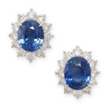 A PAIR OF SAPPHIRE AND DIAMOND CLUSTER STUD EARRINGS in 18ct white gold, each set with an oval cut