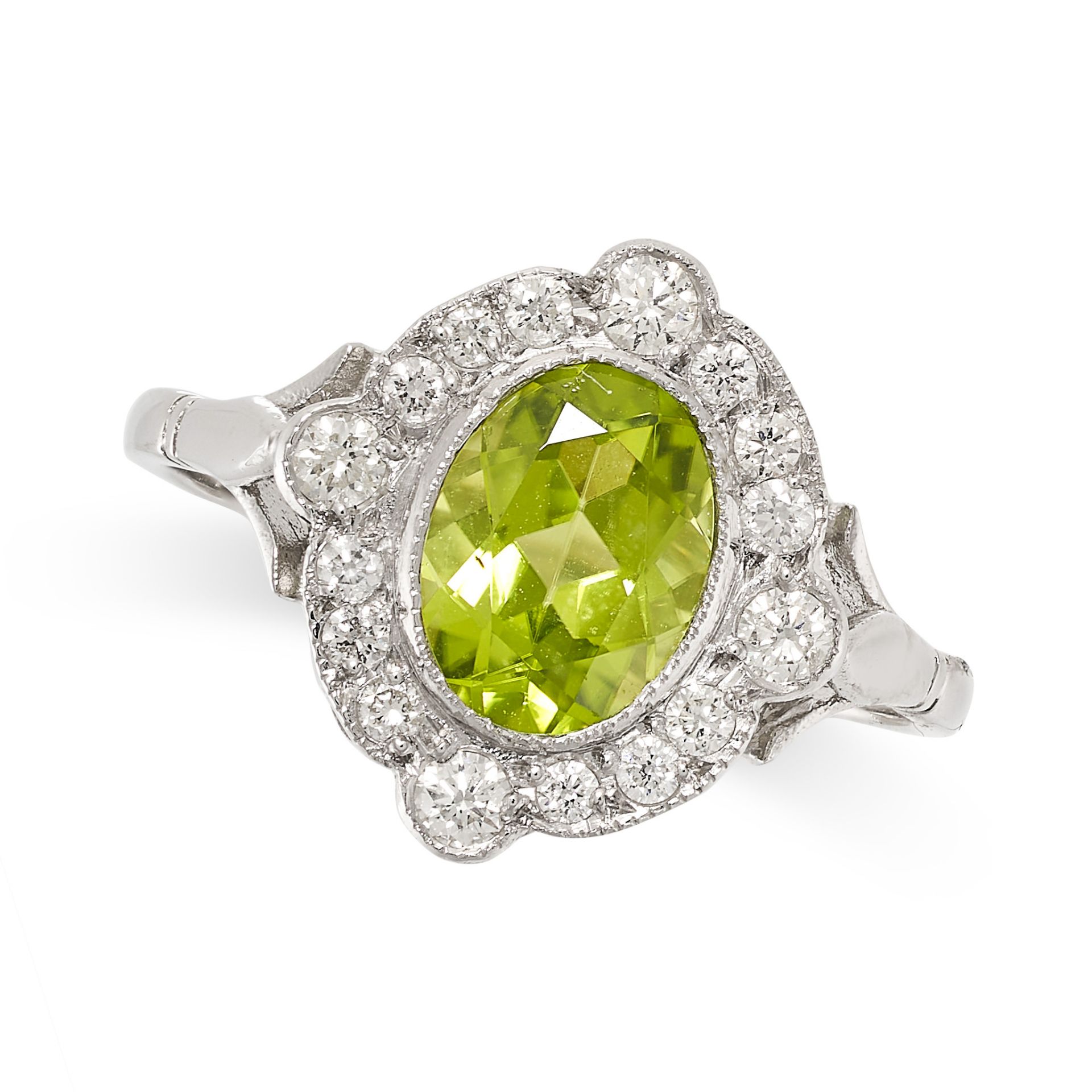A PERIDOT AND DIAMOND CLUSTER DRESS RING in platinum, set with an oval cut peridot within a border