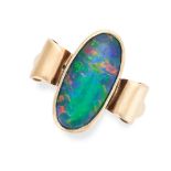 A VINTAGE OPAL RING in 9ct yellow gold, set with a black opal triplet between scrolling motifs,