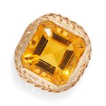 A CITRINE RING in 18ct gold, set with an octagonal step cut citrine in a stylised mount, French