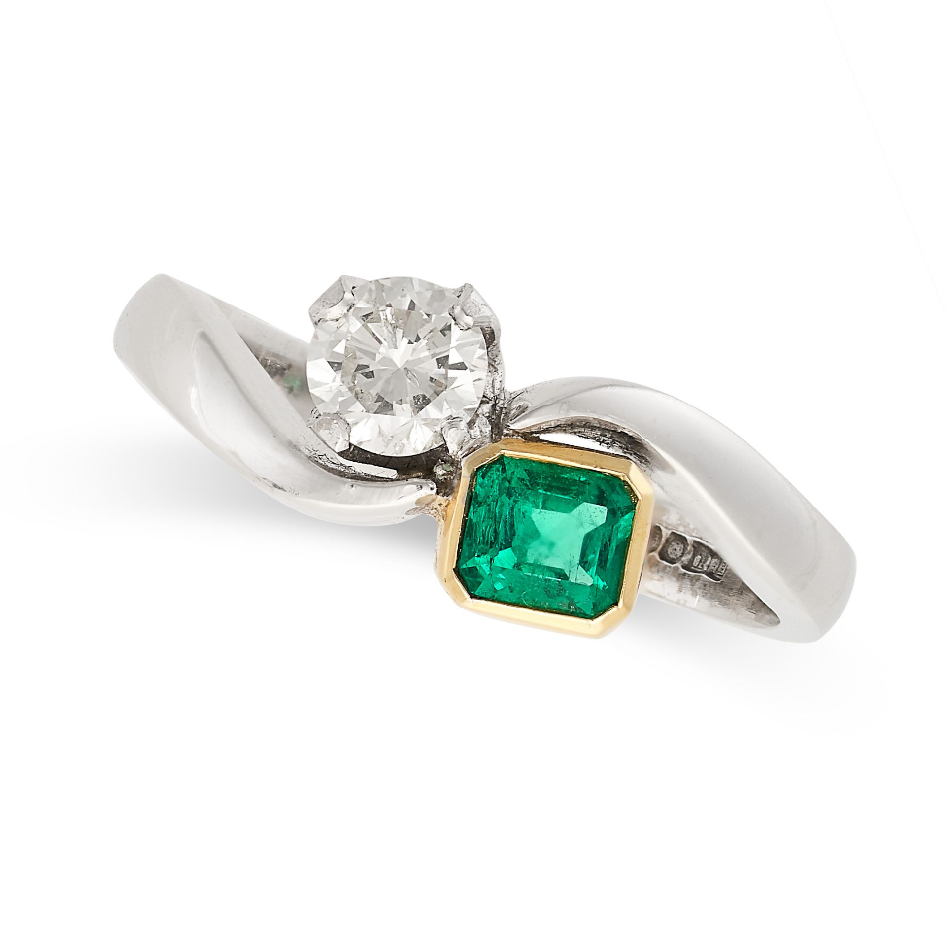 A VINTAGE EMERALD AND DIAMOND TOI ET MOI RING in 18ct white gold and yellow gold, set with an