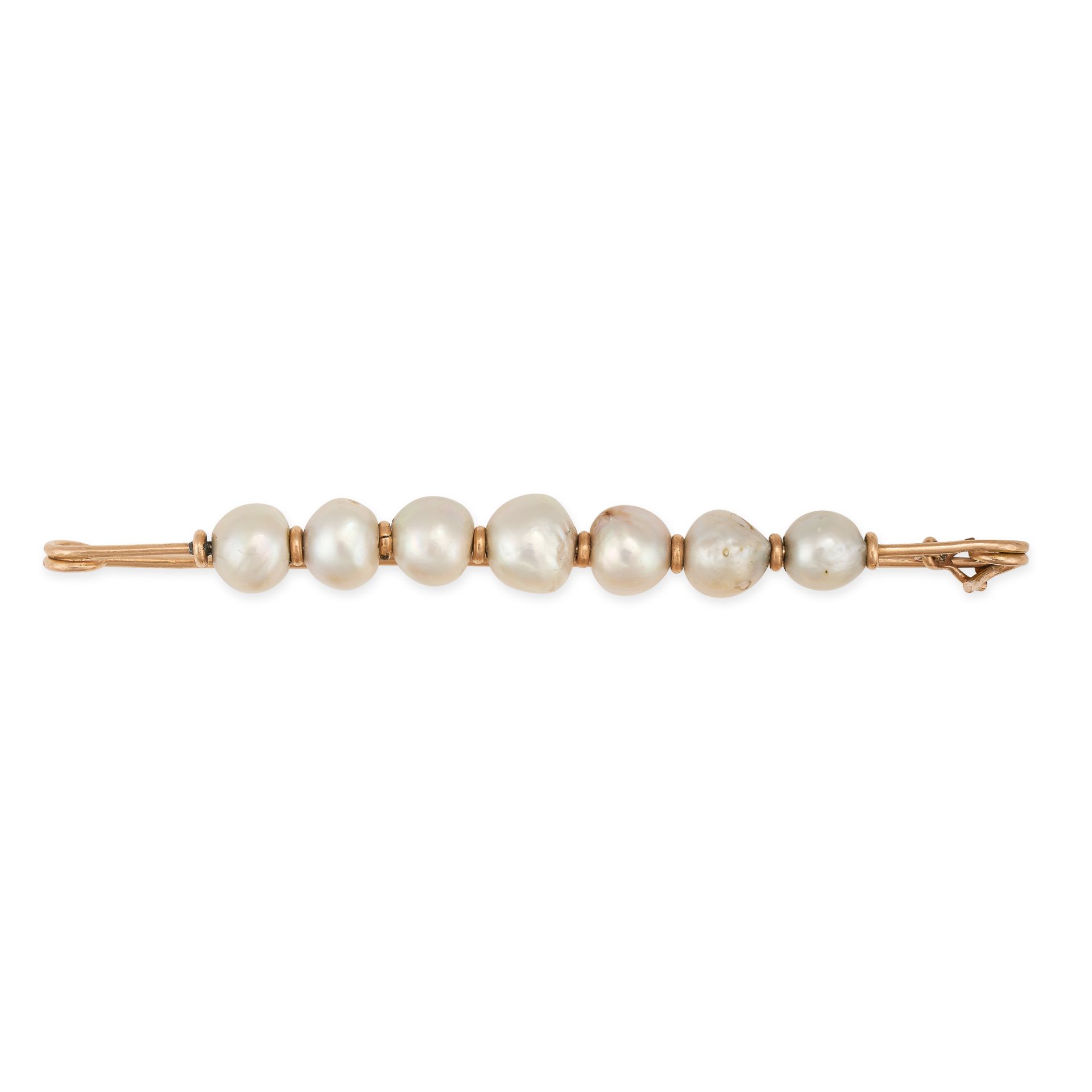 A PEARL BAR BROOCH set with a row of seven pearls, 9.1cm, 10.3g.