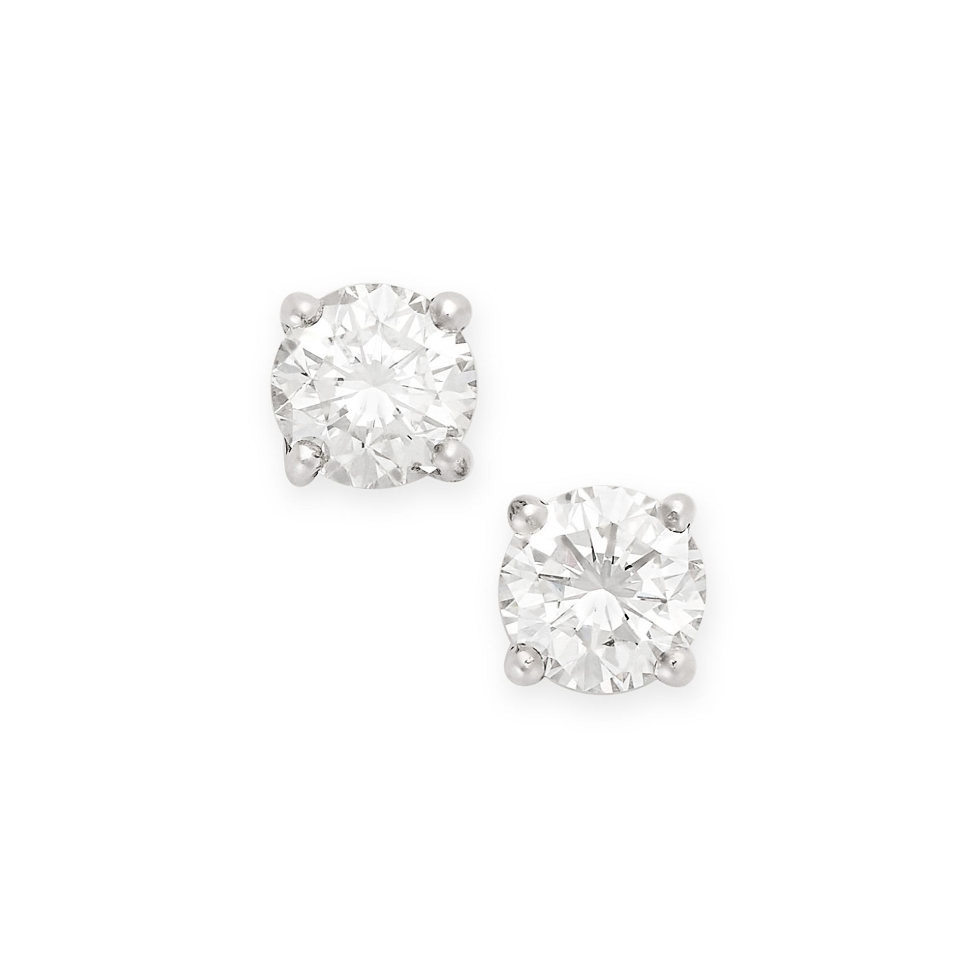 A PAIR OF DIAMOND STUD EARRINGS each set with a round brilliant cut diamond, the diamonds both