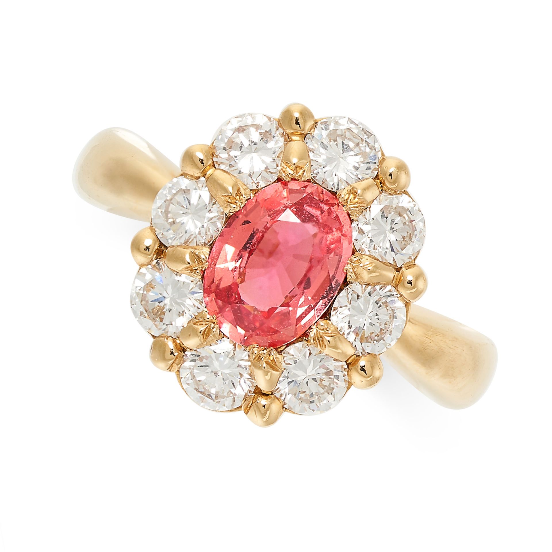 A SAPPHIRE AND DIAMOND DRESS RING in 18ct yellow gold, set with an oval cut orangey-pink sapphire of