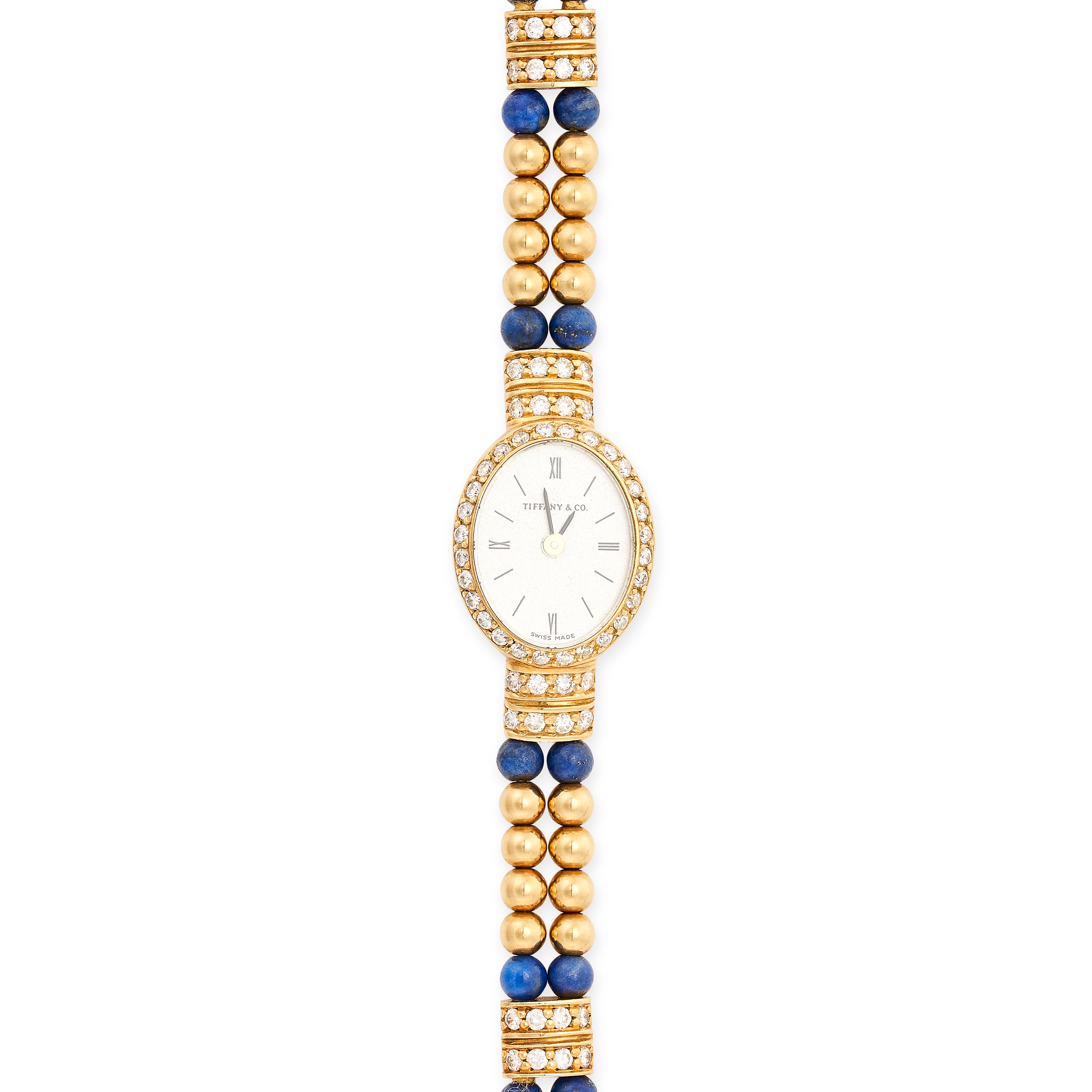 TIFFANY & CO, A VINTAGE LAPIS LAZULI AND DIAMOND WRISTWATCH in 18ct yellow gold, the oval face in