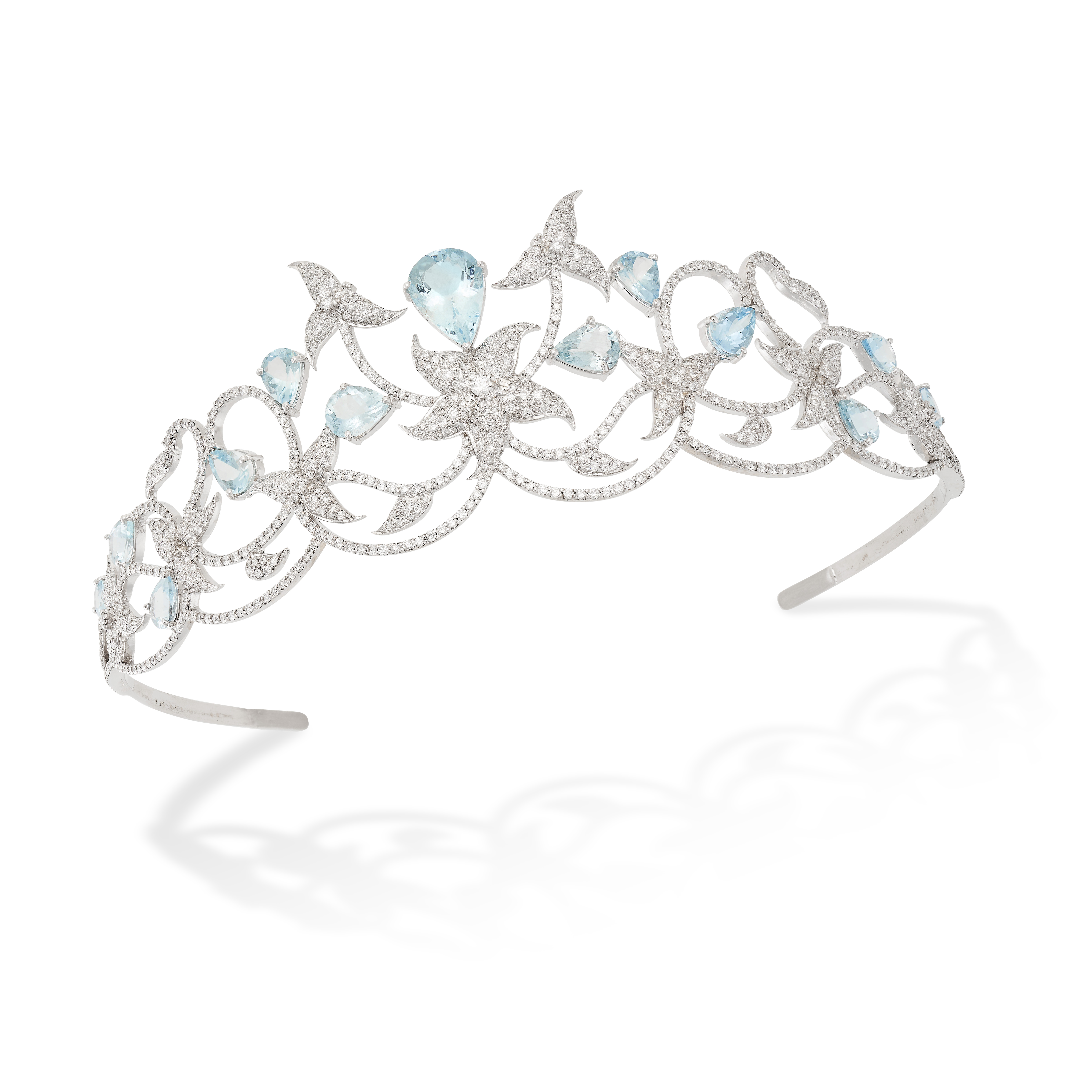 AN AQUAMARINE AND DIAMOND TIARA in 18ct white gold, in foliate design, set with pear shaped