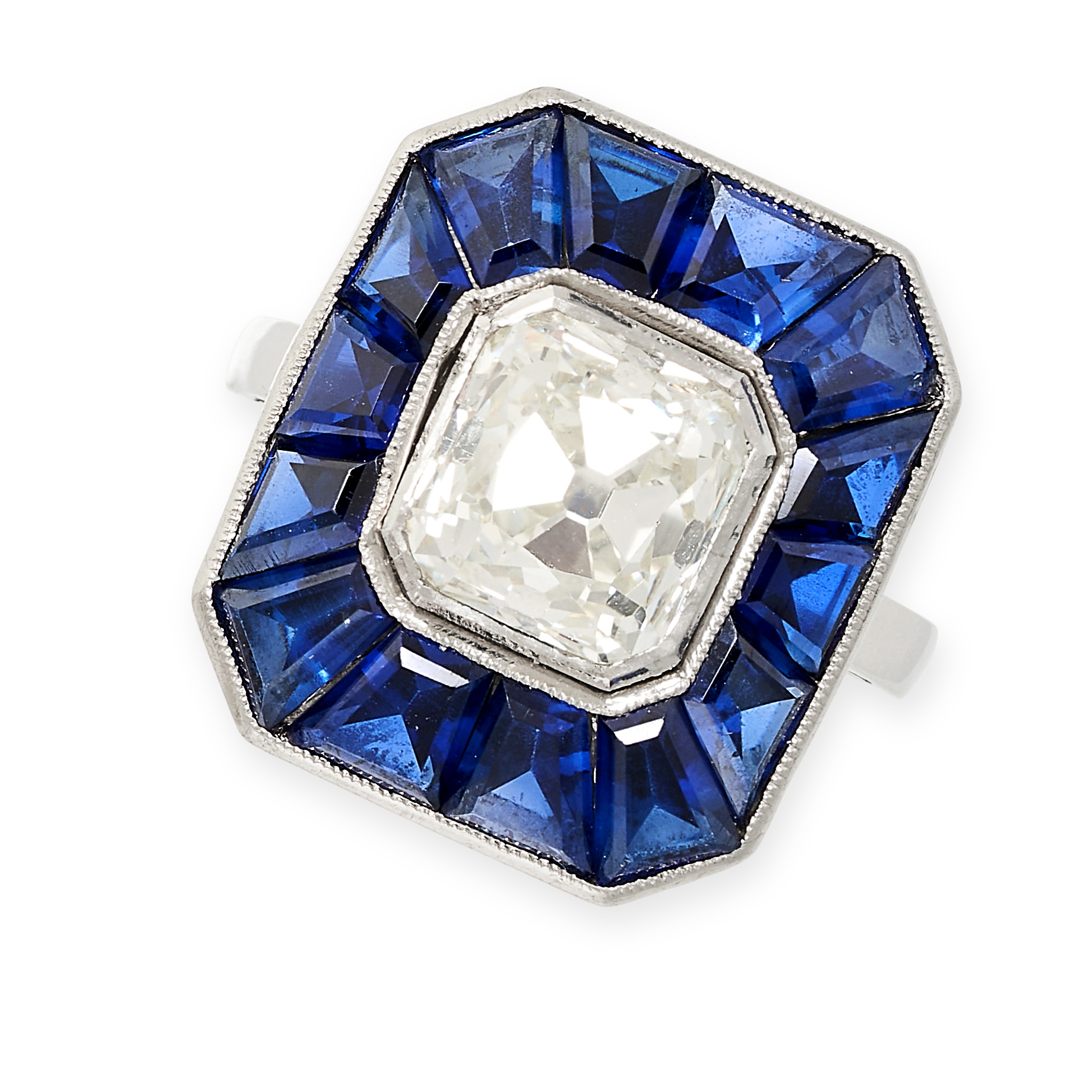 A FRENCH ART DECO DIAMOND AND SAPPHIRE RING in platinum, of target design, set with a central old