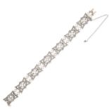 AN ANTIQUE PEARL AND DIAMOND BRACELET comprising seven geometric links set with rose cut diamonds,