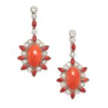 A PAIR OF ART DECO CORAL AND DIAMOND EARRINGS in platinum, each set with an oval cabochon coral,