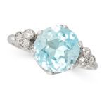 A BLUE ZIRCON AND DIAMOND DRESS RING set with a round cut blue zircon of 3.73 carats, between