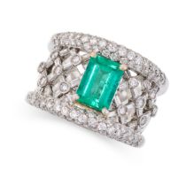 AN EMERALD AND DIAMOND RING in open work lattice design set with a step cut emerald of 1.44 carats