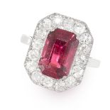 A TOURMALINE AND DIAMOND RING set with an octagonal cut tourmaline of 2.97 carats in a border of old