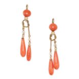 A PAIR OF CORAL DROP EARRINGS in yellow gold, each comprising a piece of coral suspending a