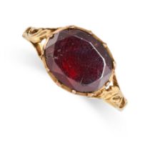 A GARNET DRESS RING in yellow gold, set with a foiled back oval cut garnet, to a later shank, no
