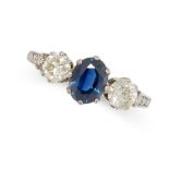 A VINTAGE SAPPHIRE AND DIAMOND RING set with an oval cut sapphire of 0.94 carats between two round