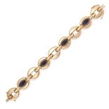 A VINTAGE AMETHYST BRACELET in yellow gold, the oval links set with four sugarloaf cabochon