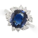 A SAPPHIRE AND DIAMOND CLUSTER RING set with a cushion cut sapphire of 6.36 carats within a border