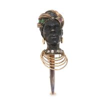 AN ANTIQUE GEMSET BLACKAMOOR BROOCH in yellow gold, designed as the bust of a man carved from