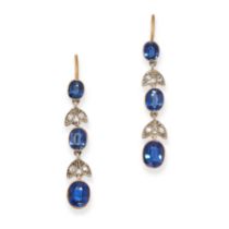 A PAIR OF SAPPHIRE AND DIAMOND DROP EARRINGS each set with three graduated oval cut sapphires