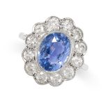 A CEYLON NO HEAT SAPPHIRE AND DIAMOND CLUSTER RING set with an oval cut blue sapphire of 3.39 carats