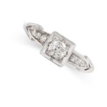 AN ART DECO DIAMOND RING in 14ct white gold, set with an old cut diamond accented by further