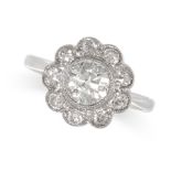 A DIAMOND CLUSTER RING in 18ct gold and platinum, set with an old cut diamond in a cluster of