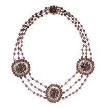AN ANTIQUE GARNET NECKLACE comprising three oval plaques set with oval and round cut garnets on a